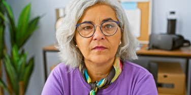 older woman stressed at having to find a new job