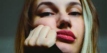 intelligent woman worrying and pouting