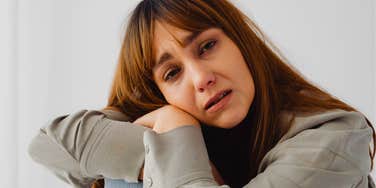 overstimulated stressed woman looking upset