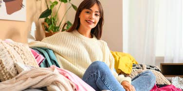 relaxed woman avoiding chores in messy living room