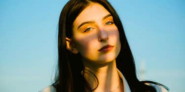 serious woman with low emotional depth staring