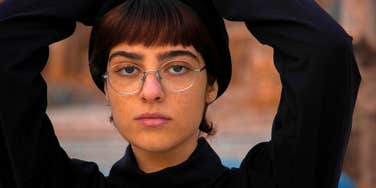 mentally and emotionally fragile woman looking stern