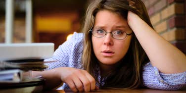stressed woman dealing with money issues