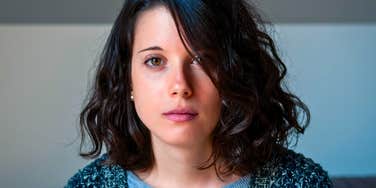 Serious brunette woman with thoughts going through her head 
