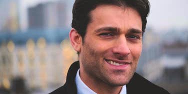 arrogant man smirking and lying about being faithful