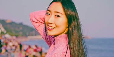 smiling woman enjoying her life feeling free outside