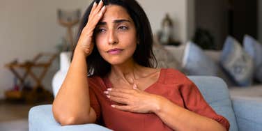 woman worried about her parents feeling responsible for them