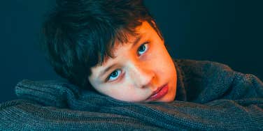 sad young boy growing up with narcissistic dad