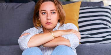 sad woman feeling stressed thinking of childhood wounds