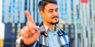 rude man disagreeing with everything shaking his finger