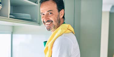 Gen X man cleaning in the kitchen 