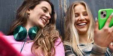 Gen Z women laughing and talking together