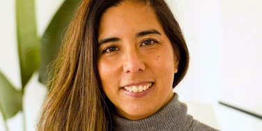 happy woman smiling thinking about her good values