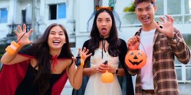 group of young friends dressed up for halloween
