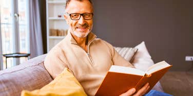 middle aged man in his 50s or 60s reading to stay sharp