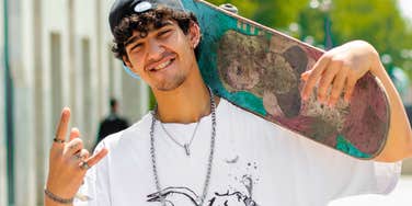 confident young skateboarder burning energy at the skate park