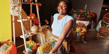 very organized woman posing after setting up seasonal decor at home