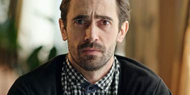 man looking stressed about financial instability 