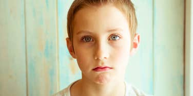 pouting boy who looks sadly at camera 