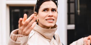 woman with a low quality vibe shrug rudely 