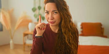 emotionally intelligent woman wagging her finger saying no