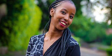 smiling emotionally intelligent woman standing outside