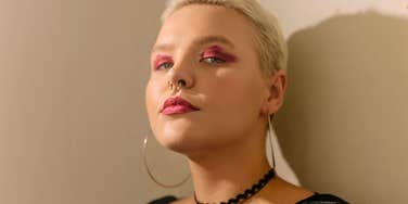 woman with no emotional consistency staring serious