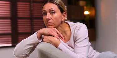 pensive sad woman who is too hard on herself