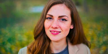 resilient woman smiling after all she's been through