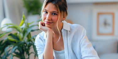 quick-thinking woman with a fast brain deep in thought smiling