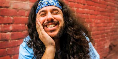 confident man who values himself smiling with teeth