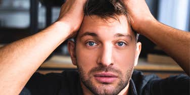 confused frazzled man dealing with tough things in life