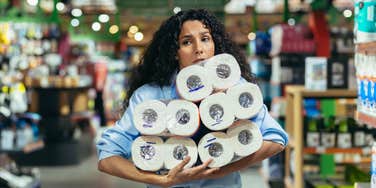 successful woman buying toilet paper
