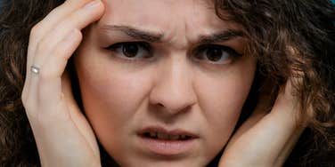 Woman feels irritated by man.