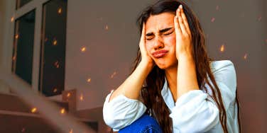 woman dealing with burnout stressed with hands on face