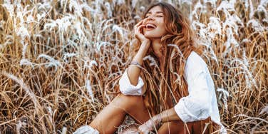 woman sitting in field