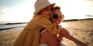 mom and daughter on beach