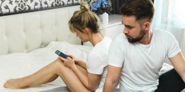 man looking at woman's texts