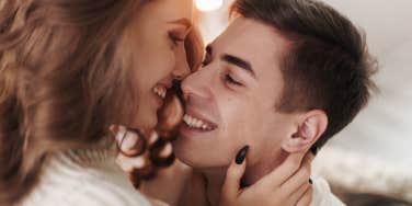 man and woman kissing