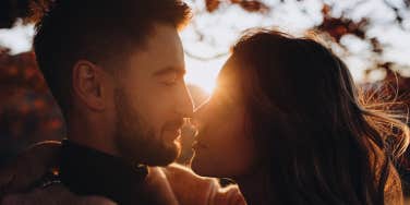 man and woman kissing