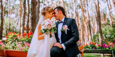bride and groom sitting in garden