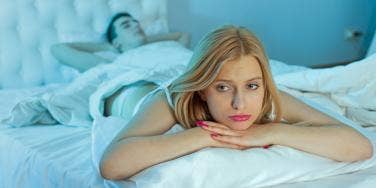 unhappy woman in bed