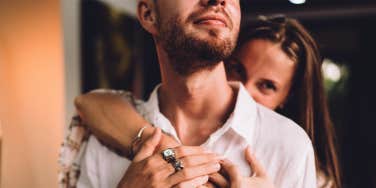 woman hugging man from behind