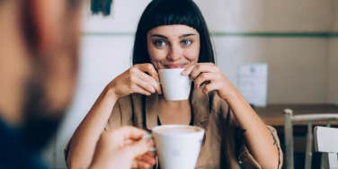 woman drinking coffee on date