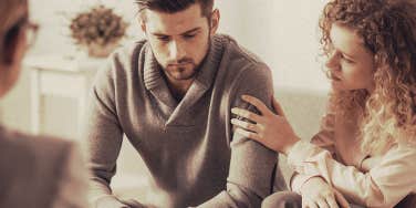 woman holding the man's arm