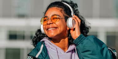 happy smiling woman listening to headphones