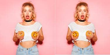 woman holding donuts in front of breasts