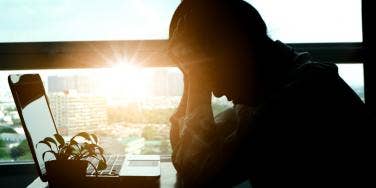 stressed worker at laptop