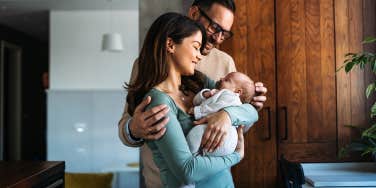 parents holding newborn