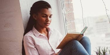 Young Black woman reading